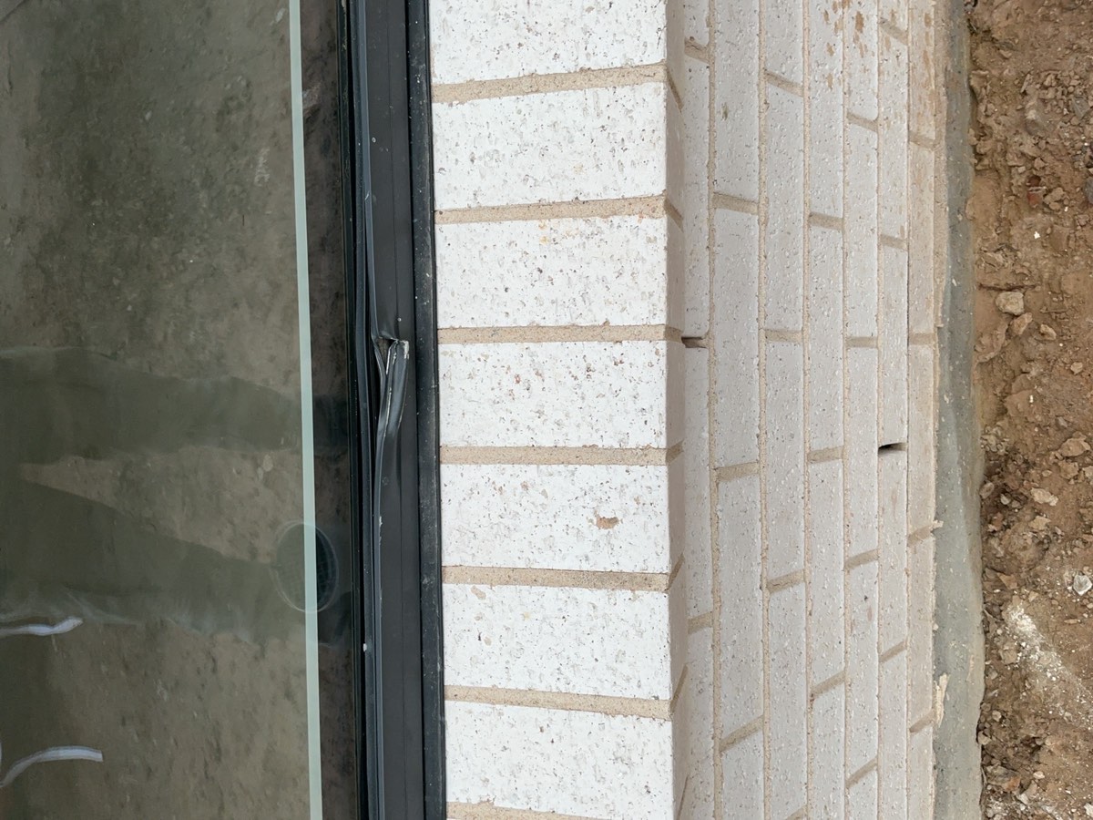 Window frame damaged, dented or scratched, recorded during a handover inspection in Oran Park